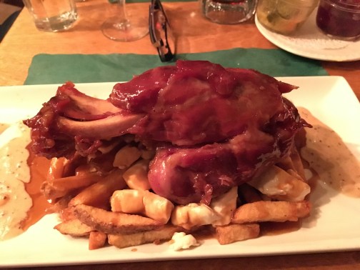 Image of ham on a bone over Poutine