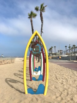 Image of surfboard art at the beach.