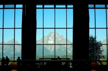 Image of mountains in window of lodge.