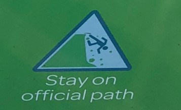 Image of a man falling head first off cliffs.