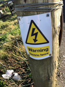 Image of sign that says, "Warning, Electric Fence."