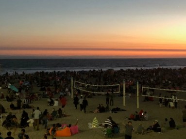 Image of crowd gathered at the beach.